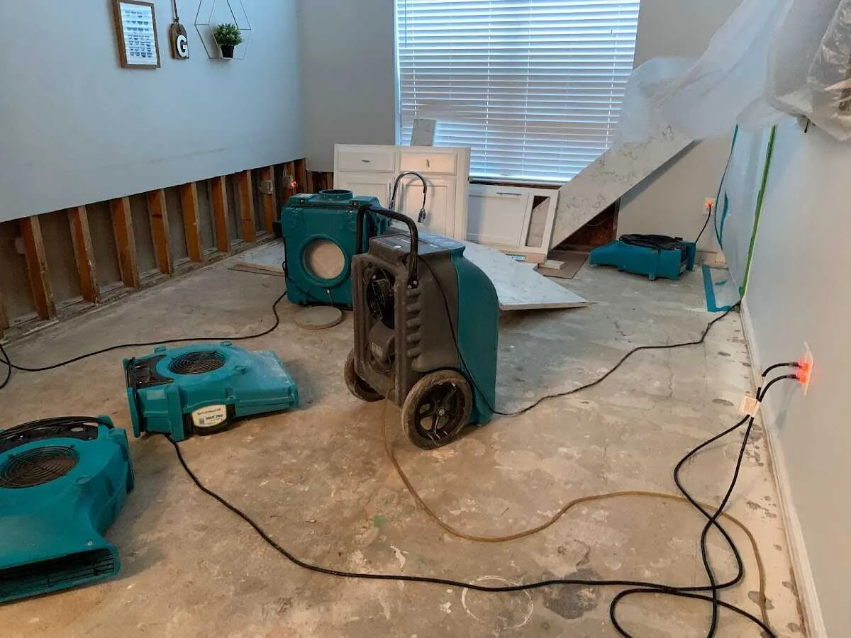 Dehumidifier in flood-cut room for Water Damage Restoration in Dennis